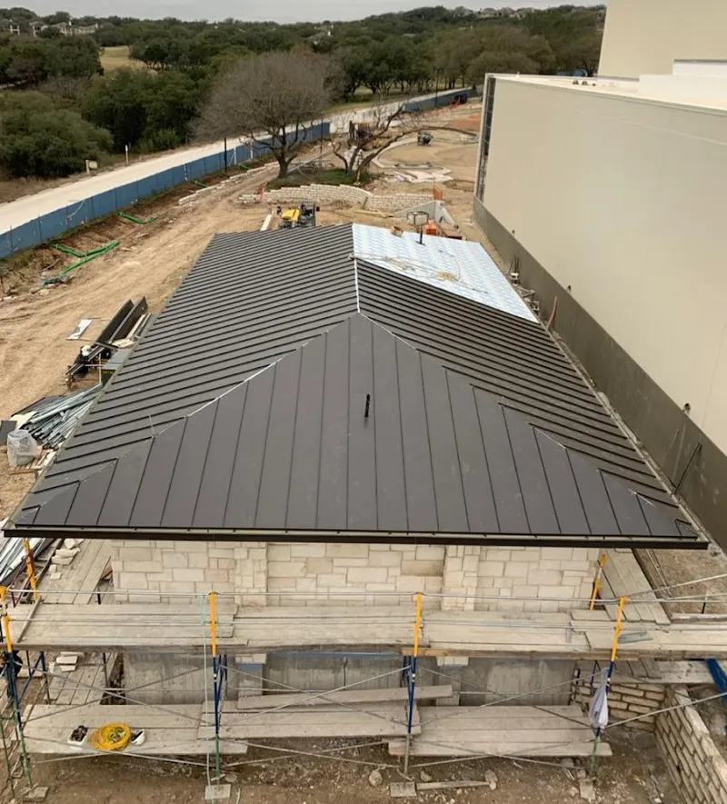 Metal roof new construction with scaffolding in Torrington